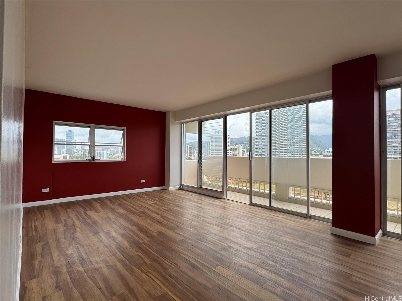 2085 Ala Wai Boulevard, Unit B94 Honolulu, HI 96815 - Photo 2 of 23 wooden floor in an empty room with a window