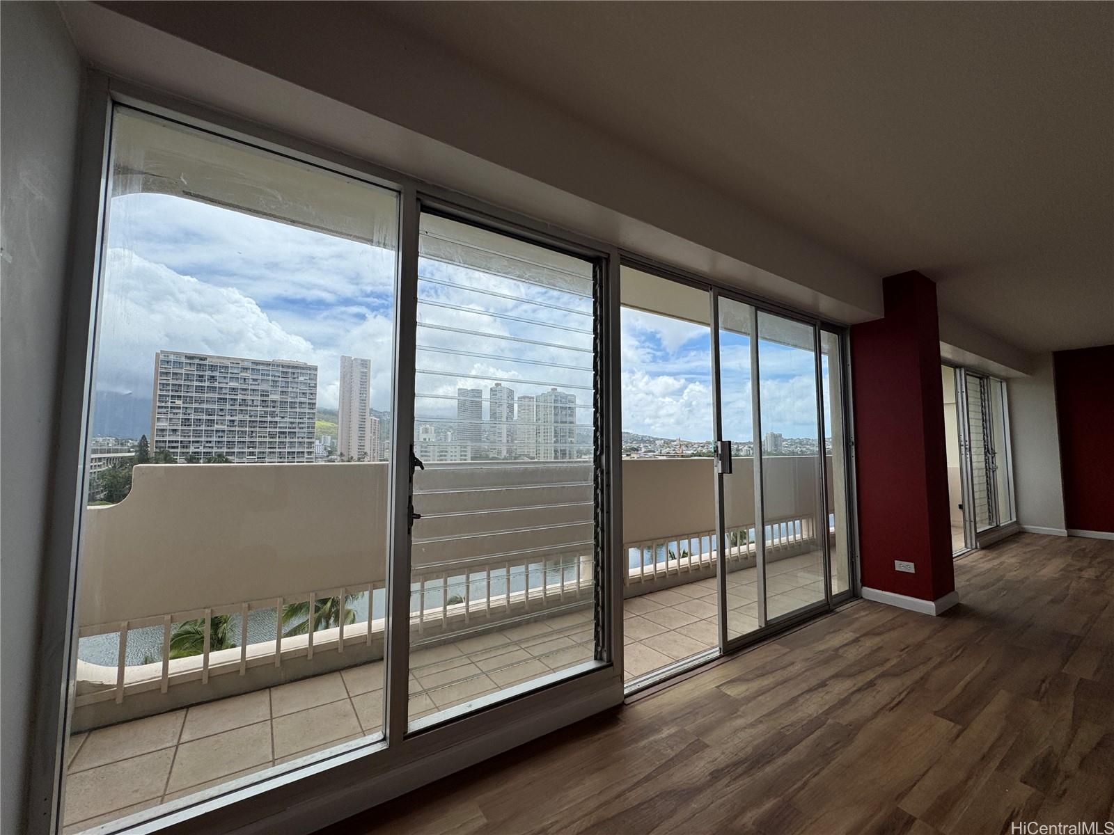 2085 Ala Wai Boulevard, Unit B94 Honolulu, HI 96815 - Photo 4 of 23 a view of a room with wooden floor and windows