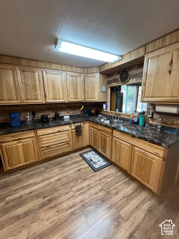 367 East Rio Grande Avenue Marysvale, UT 84750 - Photo 26 of 34 Kitchen featuring light wood-style flooring, a textured ceiling, dark stone counters, and light brown cabinets