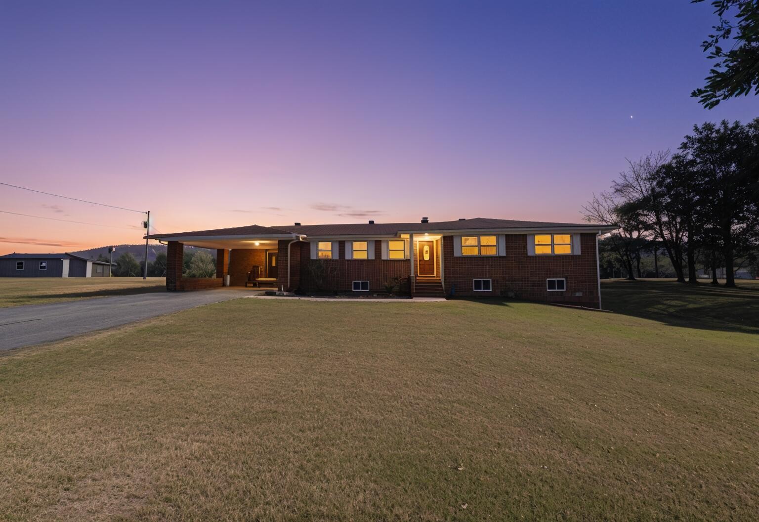 a front view of a house with a yard and a garage