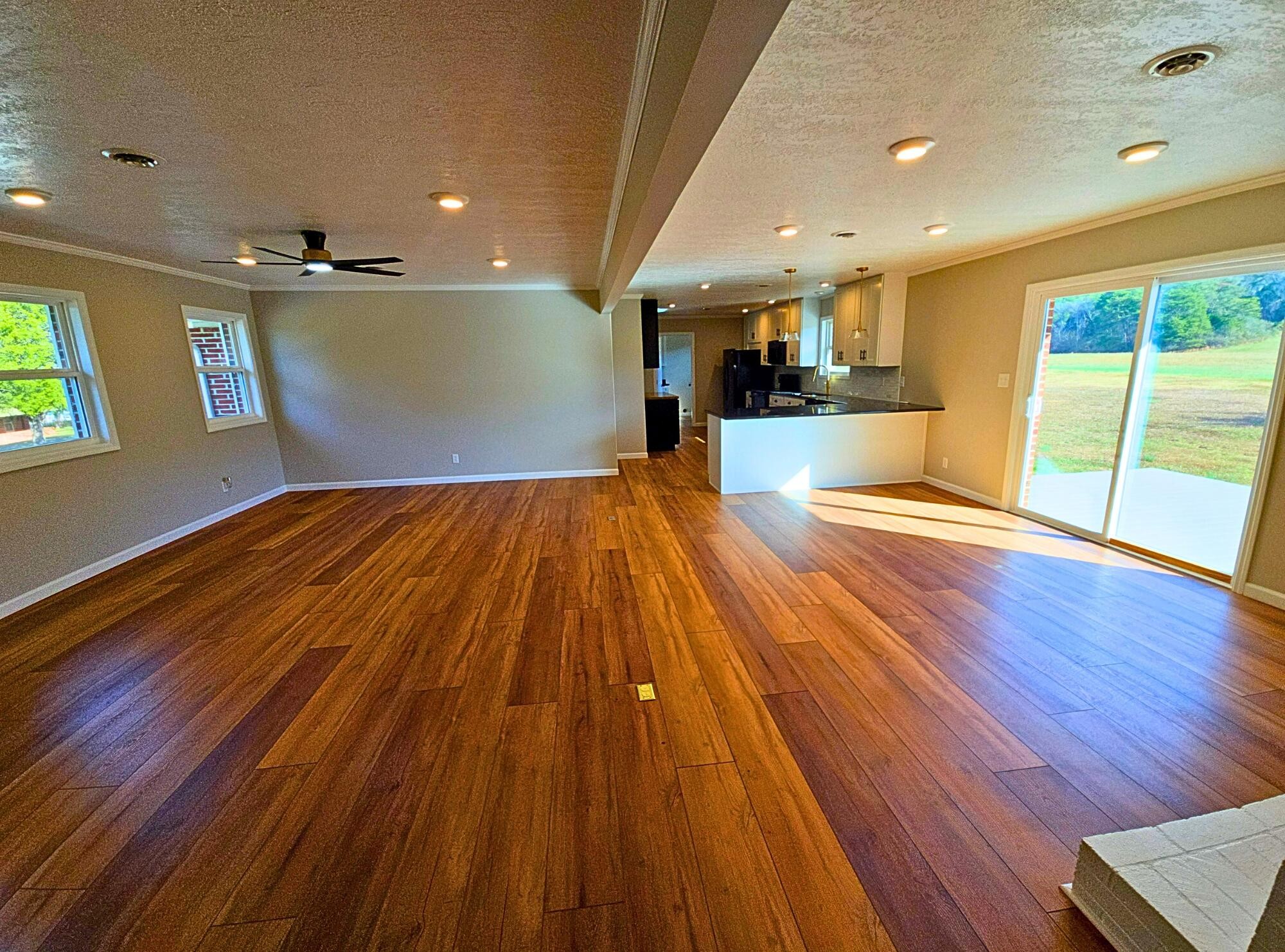 858 Main Street Decatur, TN 37322 - Photo 12 of 47 a view of empty room with wooden floor and windows
