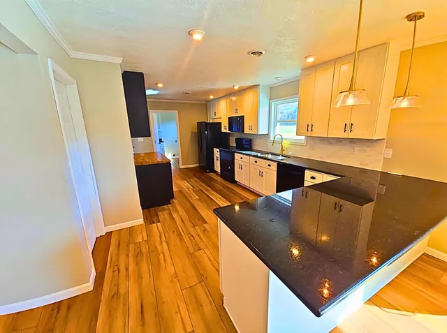a living room with wooden floor