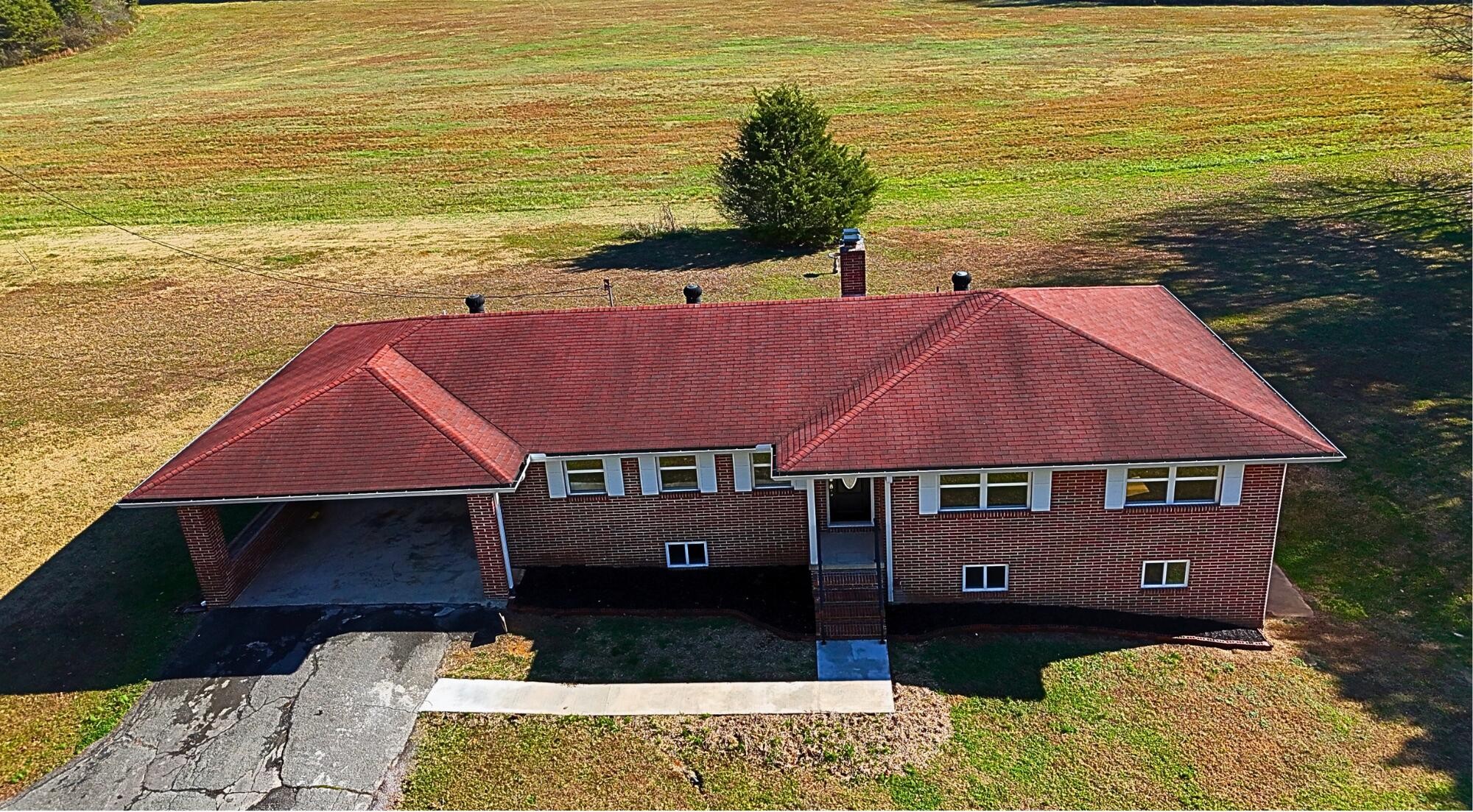858 Main Street Decatur, TN 37322 - Photo 2 of 47 a front view of a house with a yard