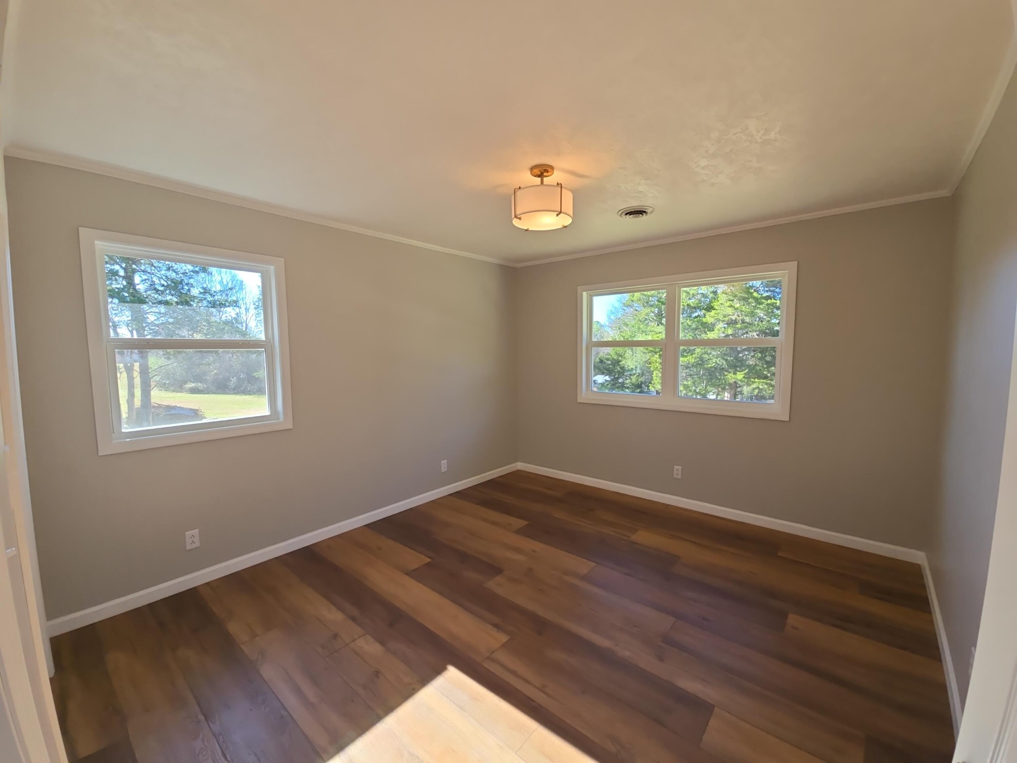 858 Main Street Decatur, TN 37322 - Photo 21 of 43 a view of an empty room with wooden floor and a window