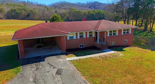 a aerial view of a house with table and chair