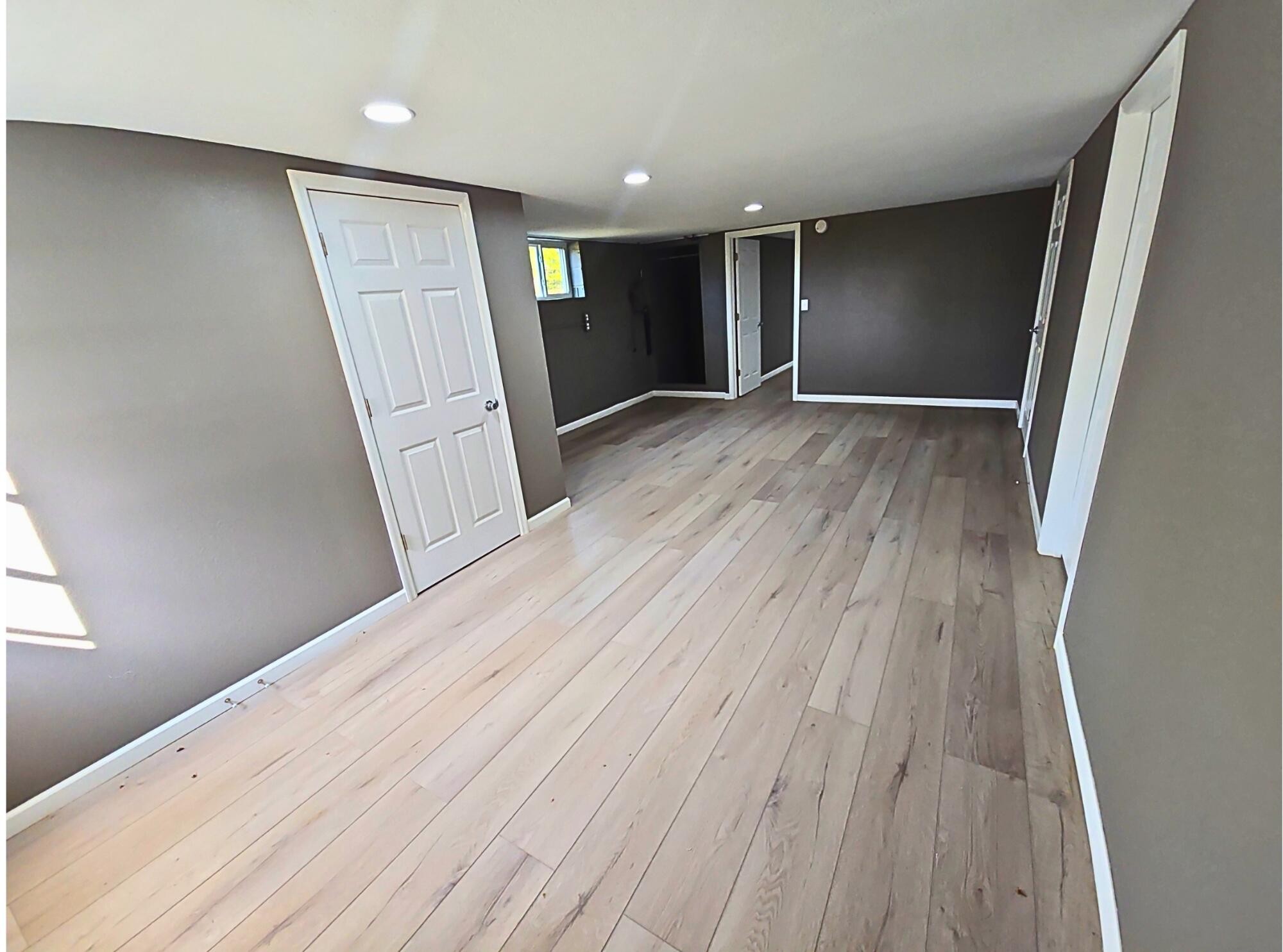 858 Main Street Decatur, TN 37322 - Photo 32 of 47 a view of an empty room with wooden floor and stairs