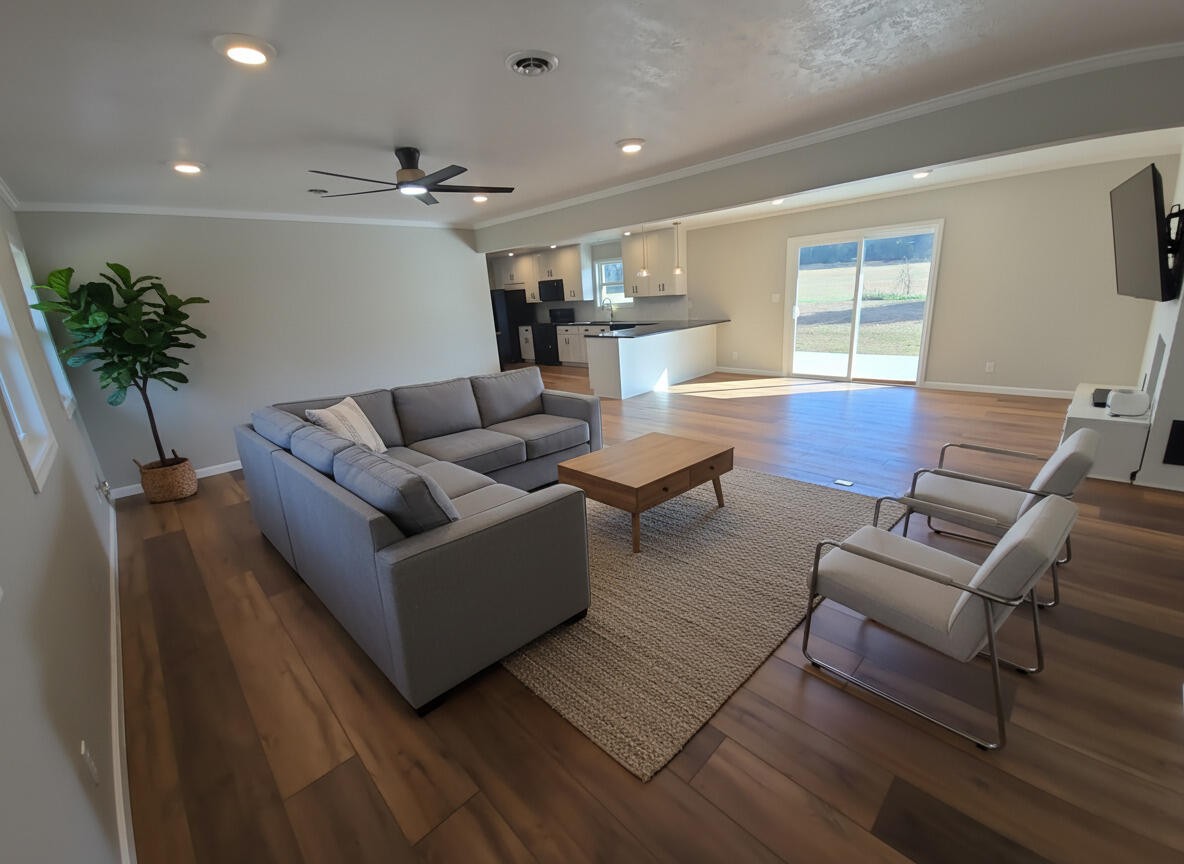 858 Main Street Decatur, TN 37322 - Photo 5 of 43 a living room with furniture and a potted plant
