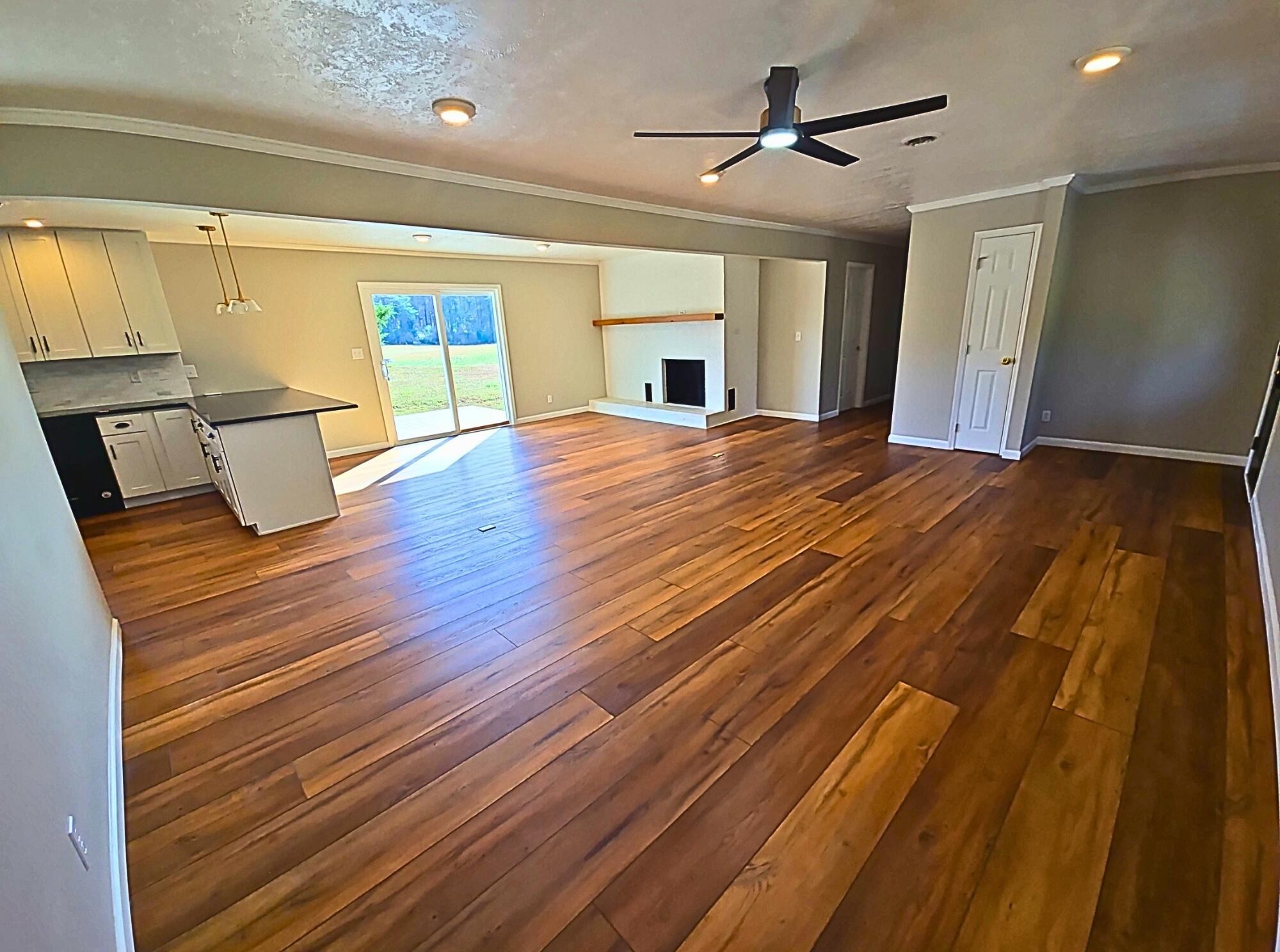 858 Main Street Decatur, TN 37322 - Photo 10 of 47 a bedroom with wooden floor ceiling fan and window