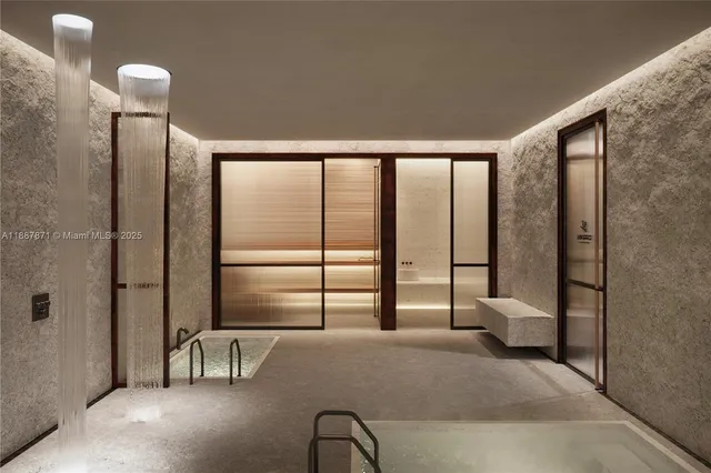 a spacious bathroom with a tub and a double vanity sink mirror