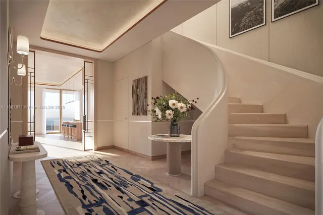 a living room with wooden floor and a rug