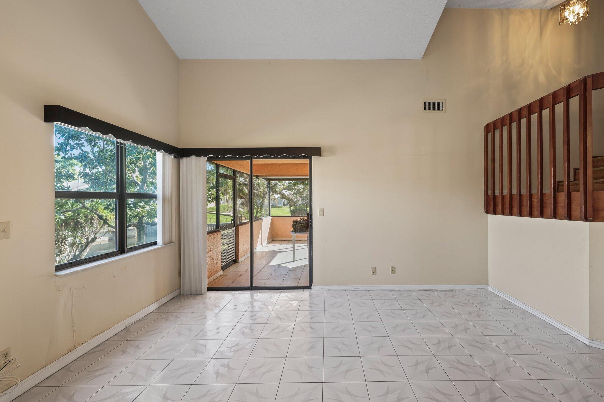1235 Northwest 19th Terrace Delray Beach, FL 33445 - Photo 13 of 45 a view of an empty room with a window