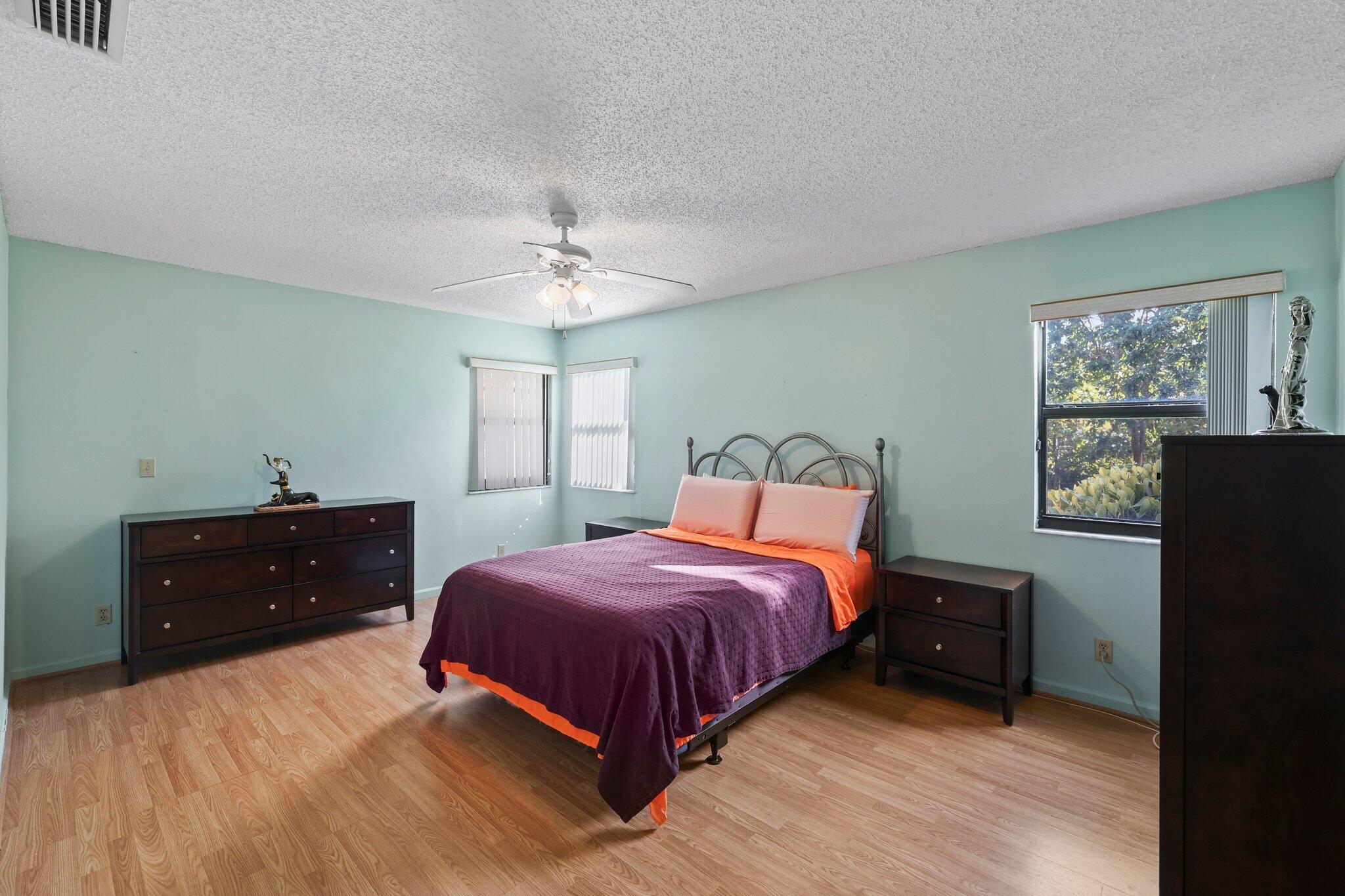 1235 Northwest 19th Terrace Delray Beach, FL 33445 - Photo 15 of 45 a bedroom with a bed and a window
