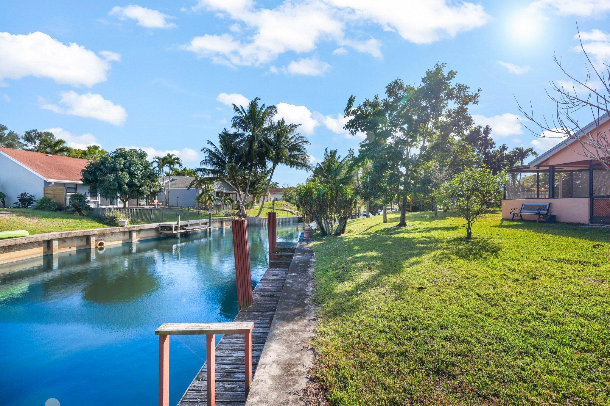 1235 Northwest 19th Terrace Delray Beach, FL 33445 - Photo 26 of 45 a view of a water with a building in the background