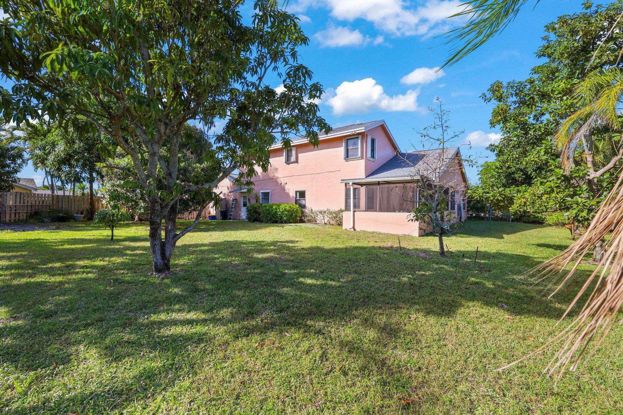 1235 Northwest 19th Terrace Delray Beach, FL 33445 - Photo 28 of 45 a view of a house with a yard