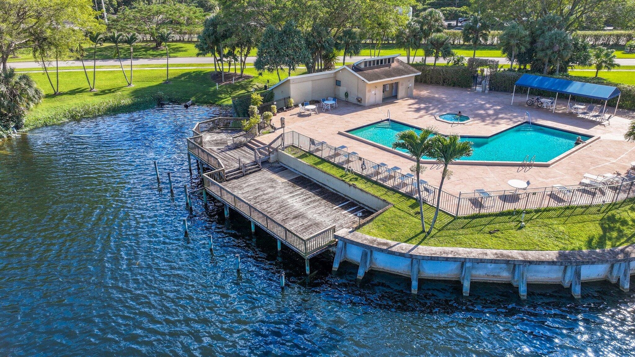 1235 Northwest 19th Terrace Delray Beach, FL 33445 - Photo 36 of 45 a view of a backyard with sitting area