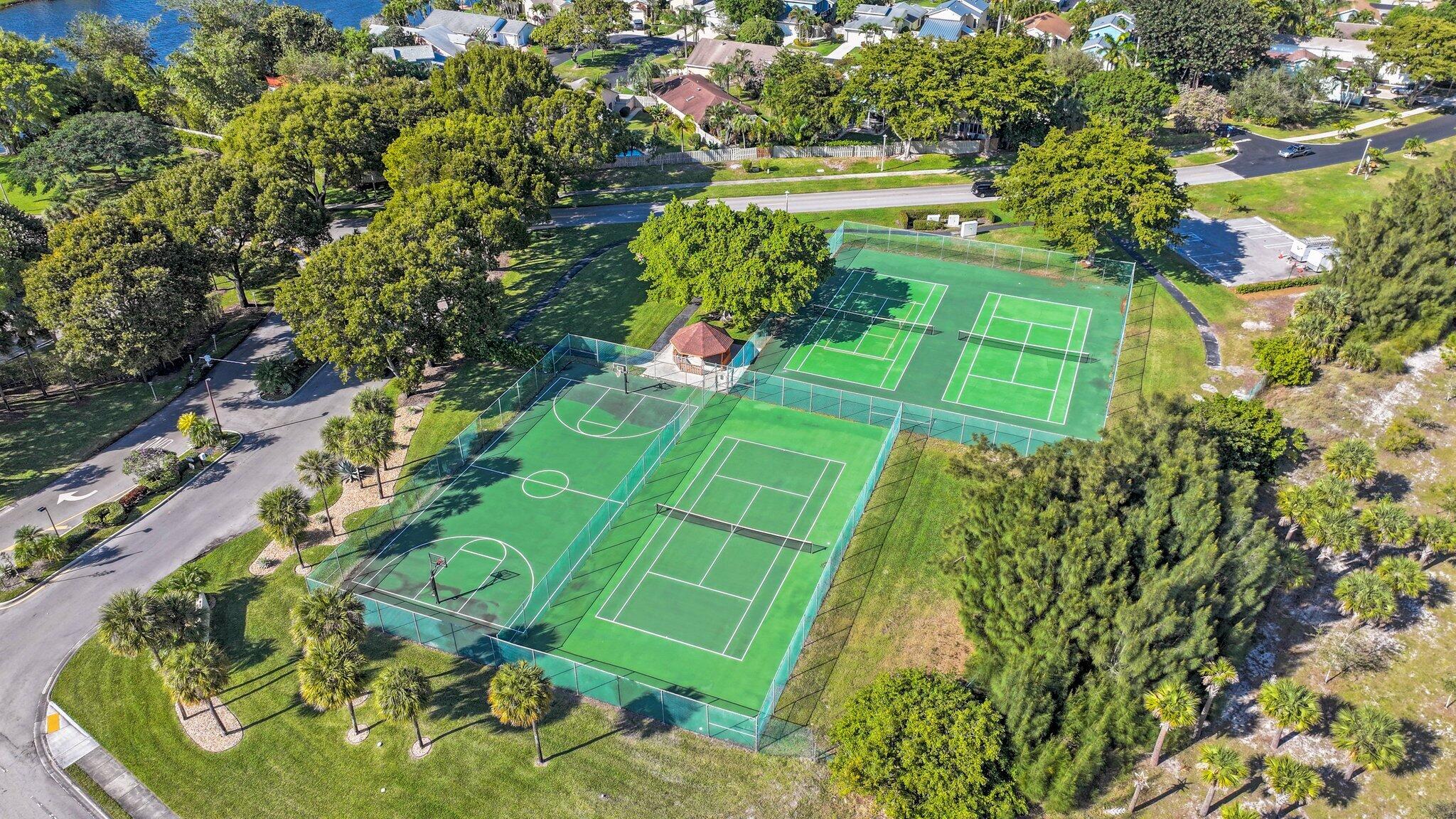 1235 Northwest 19th Terrace Delray Beach, FL 33445 - Photo 37 of 45 a green field with lots of trees