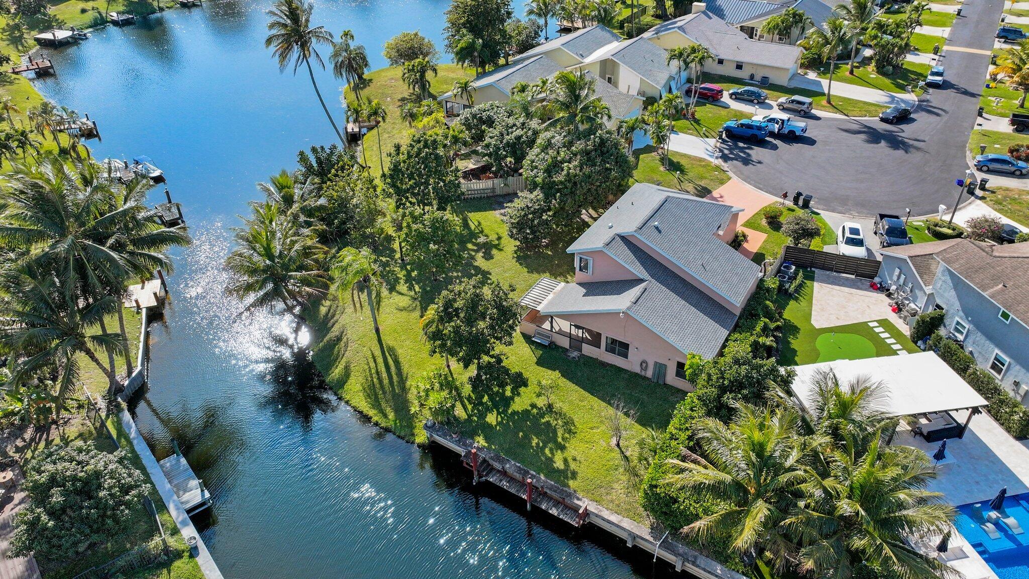 1235 Northwest 19th Terrace Delray Beach, FL 33445 - Photo 41 of 45 an aerial view of house with yard swimming pool and outdoor seating