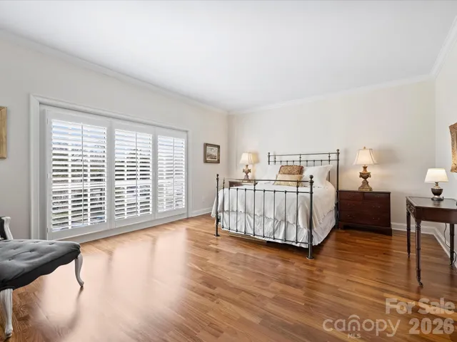 a bedroom with furniture and window