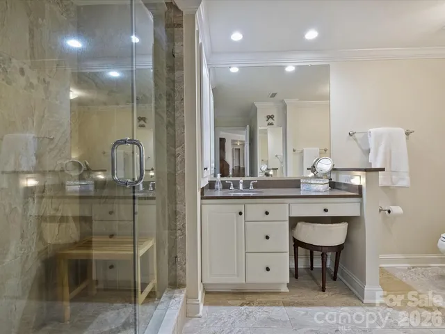 a bathroom with a sink double vanity and a mirror