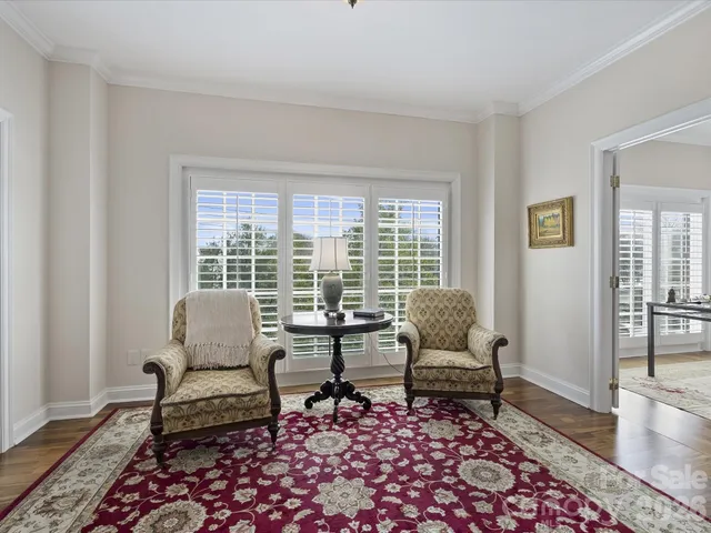 a living room with furniture and a rug
