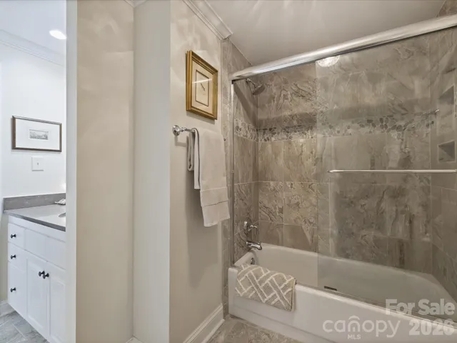 a bathroom with a bathtub and shower