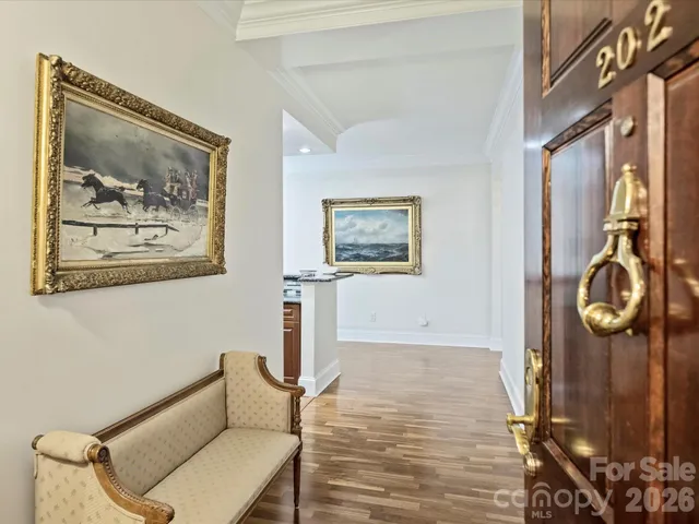 a view of a hallway with paintings on the wall
