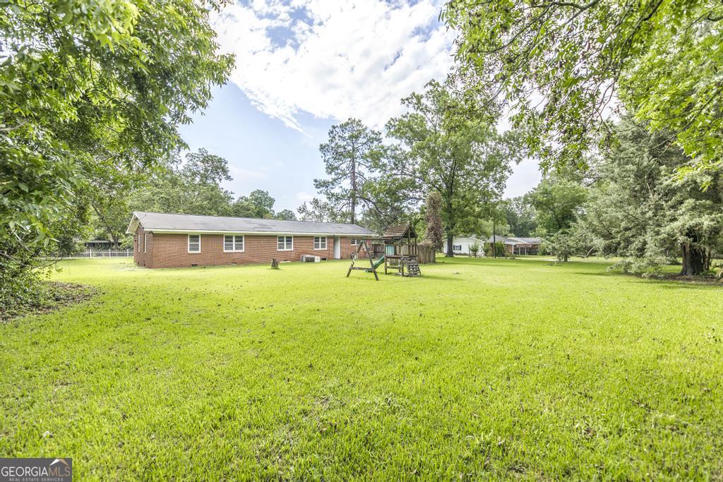 208 South 6th Street Vienna, GA 31092 - Photo 14 of 29 a view of a house with a yard