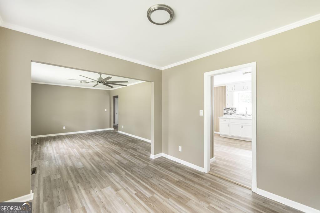 208 South 6th Street Vienna, GA 31092 - Photo 27 of 29 wooden floor in an empty room