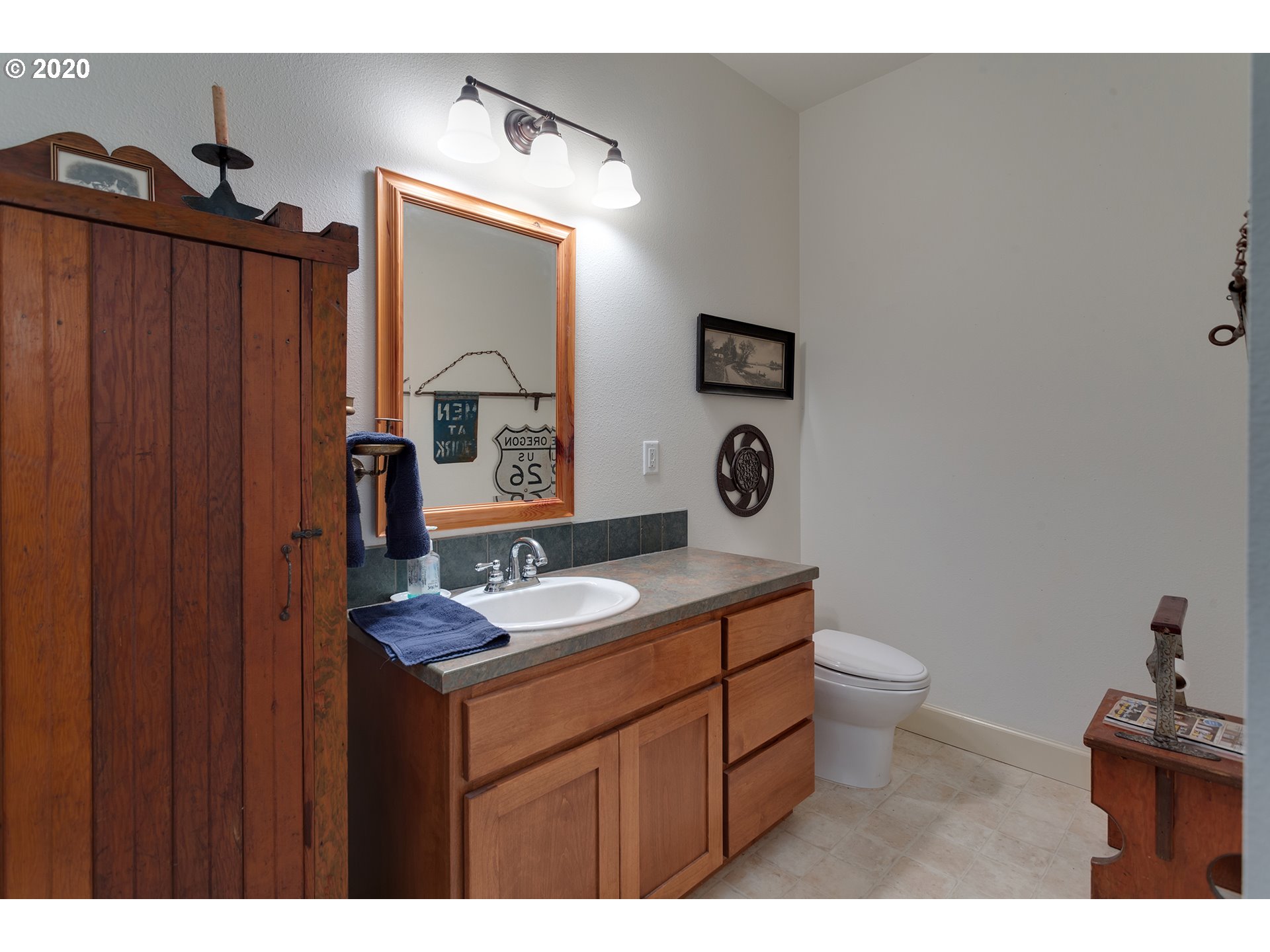 37220 Southeast Bluff Road Boring, OR 97009 - Photo 11 of 26 a bathroom with a sink toilet and mirror
