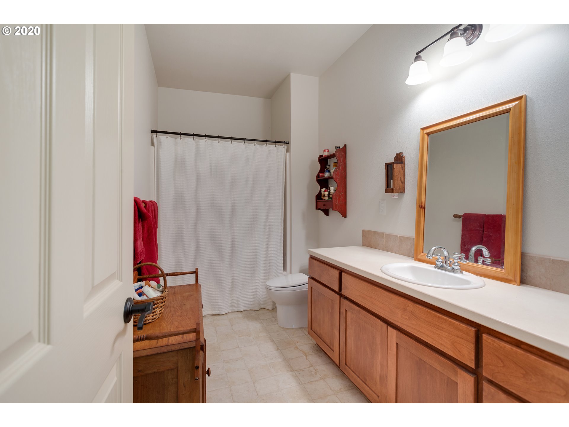 37220 Southeast Bluff Road Boring, OR 97009 - Photo 13 of 26 a bathroom with a sink vanity and a mirror