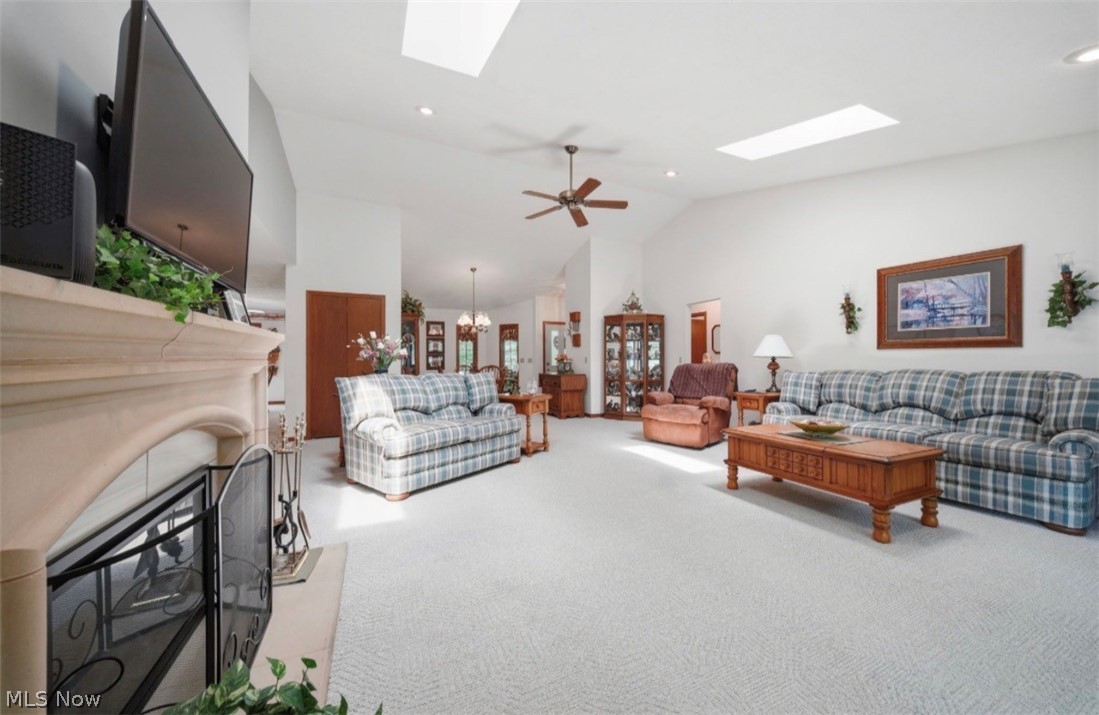 3556 Lake Road Conneaut, OH 44030 - Photo 21 of 39 Spacious living area featuring a vaulted ceiling with two skylights, recessed lighting, and a ceiling fan