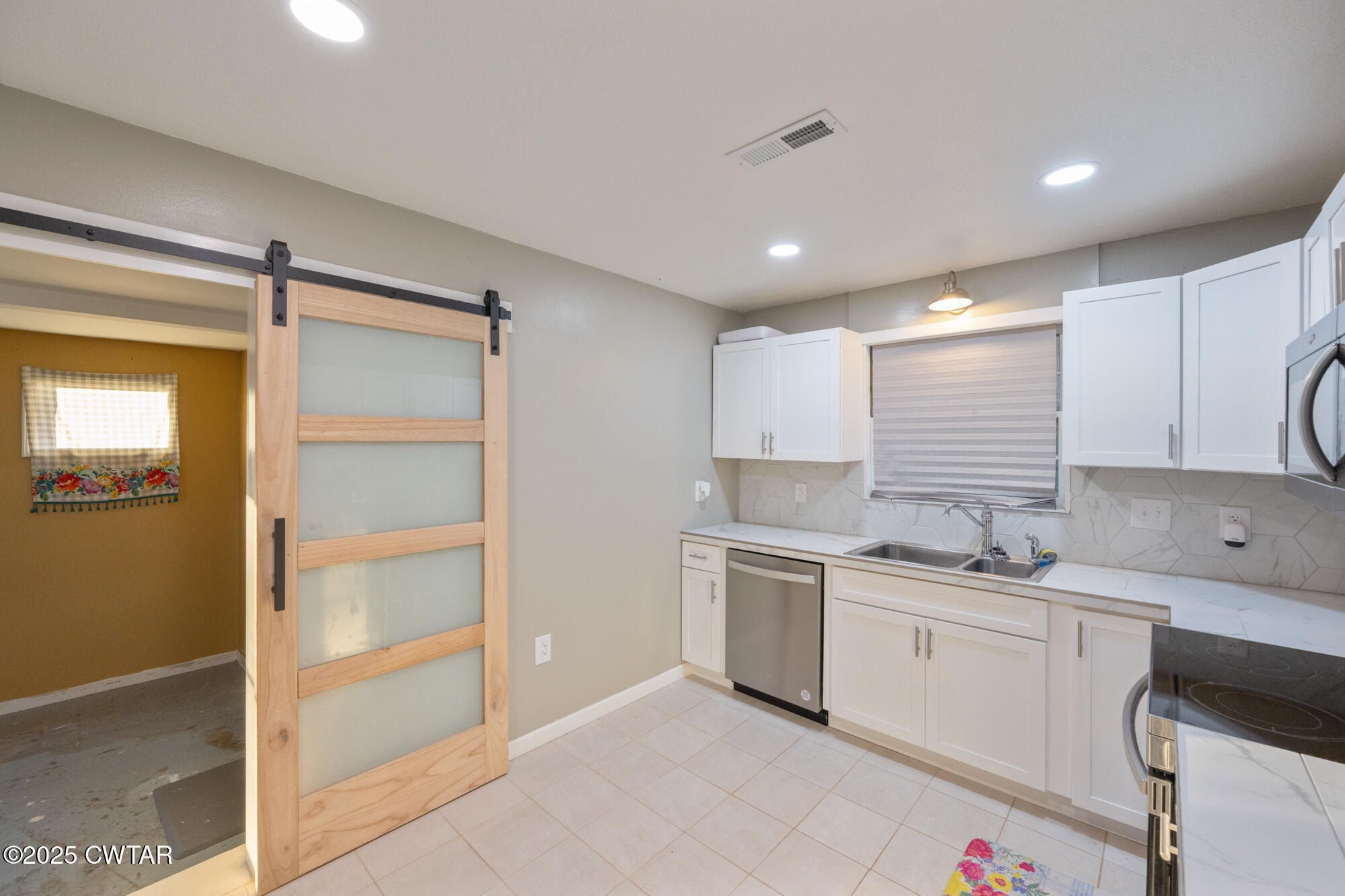 110 Highway 220 Cedar Grove, TN 38321 - Photo 8 of 12 a kitchen with a sink stainless steel appliances and cabinets