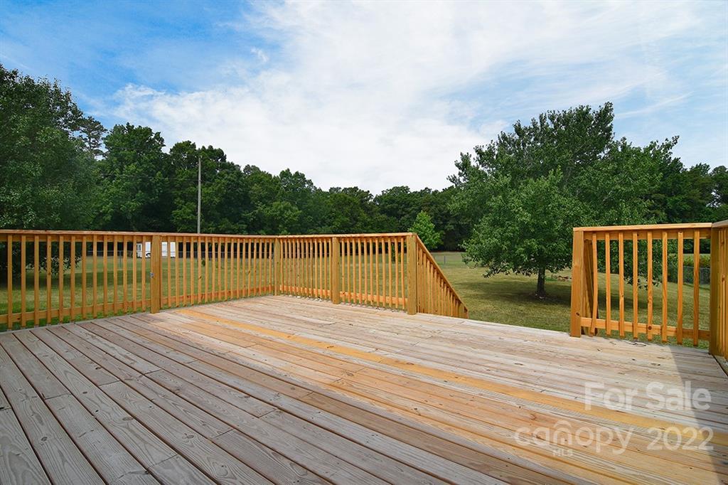 3411 Helms Pond Road, Unit 3 Monroe, NC 28110 - Photo 28 of 33 a view of deck with wooden floor and fence
