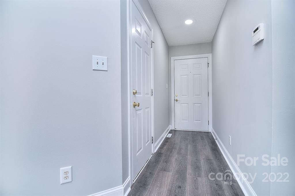 3411 Helms Pond Road, Unit 3 Monroe, NC 28110 - Photo 4 of 33 a view of a hallway with wooden floor