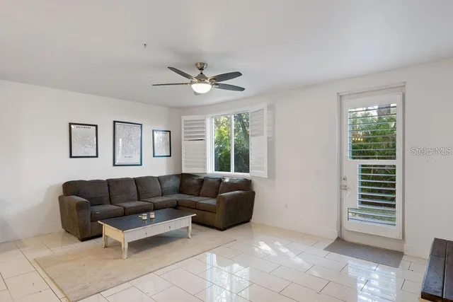 a living room with furniture and a window