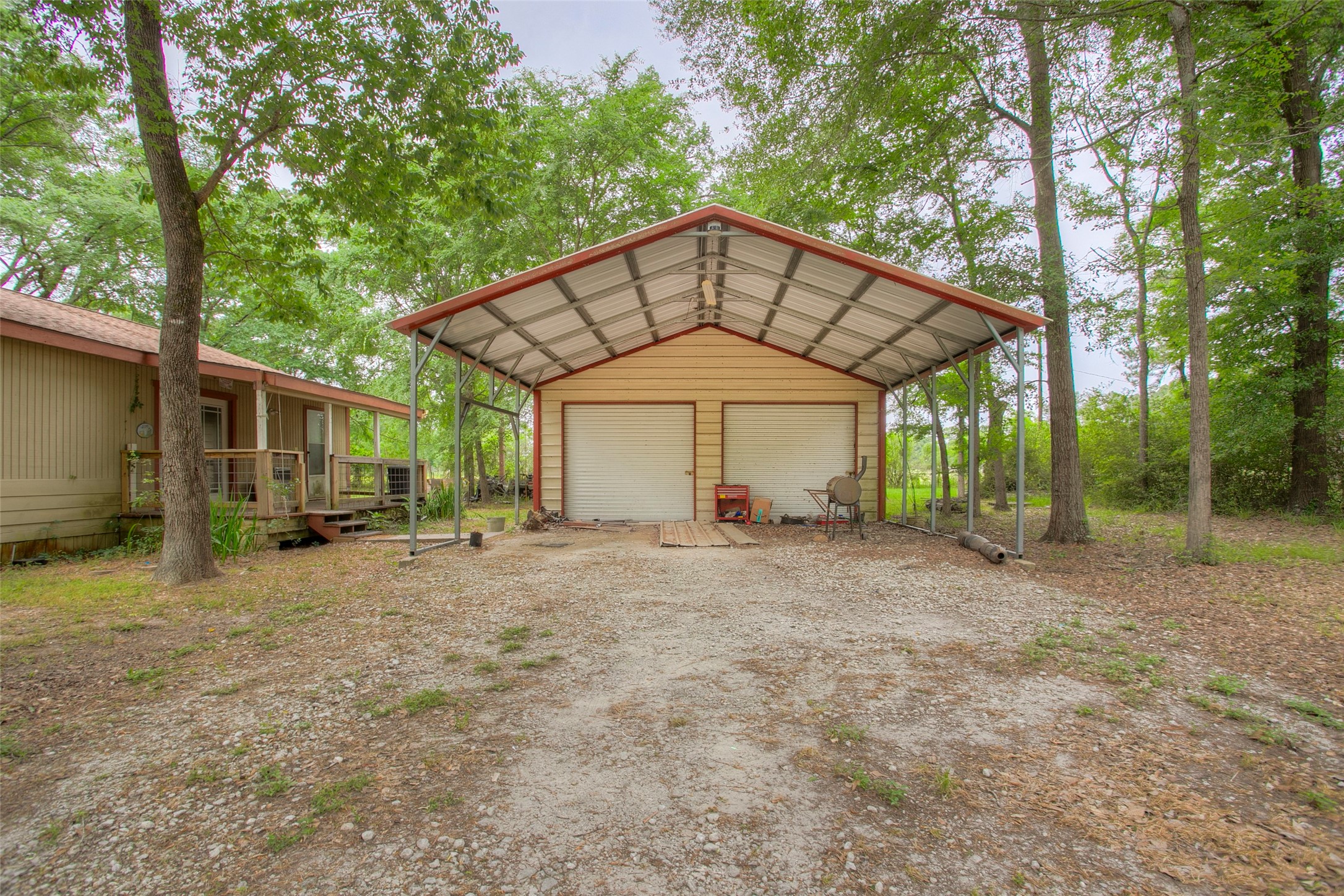 81 Westlake Road Trinity, TX 75862 - Photo 3 of 23 a view of a house with a yard and large tree