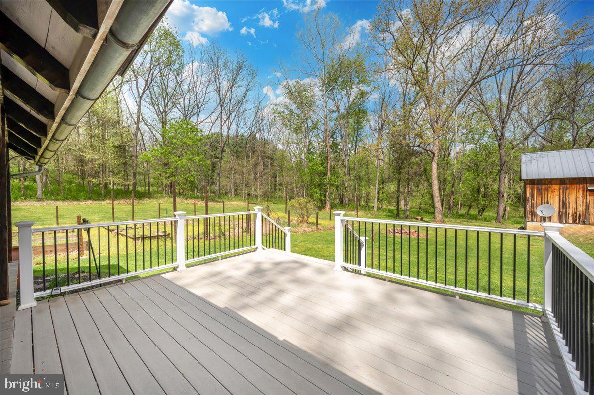 16926 Sprecher Road Sharpsburg, MD 21782 - Photo 43 of 76 Serene deck overlooking lush greenery.