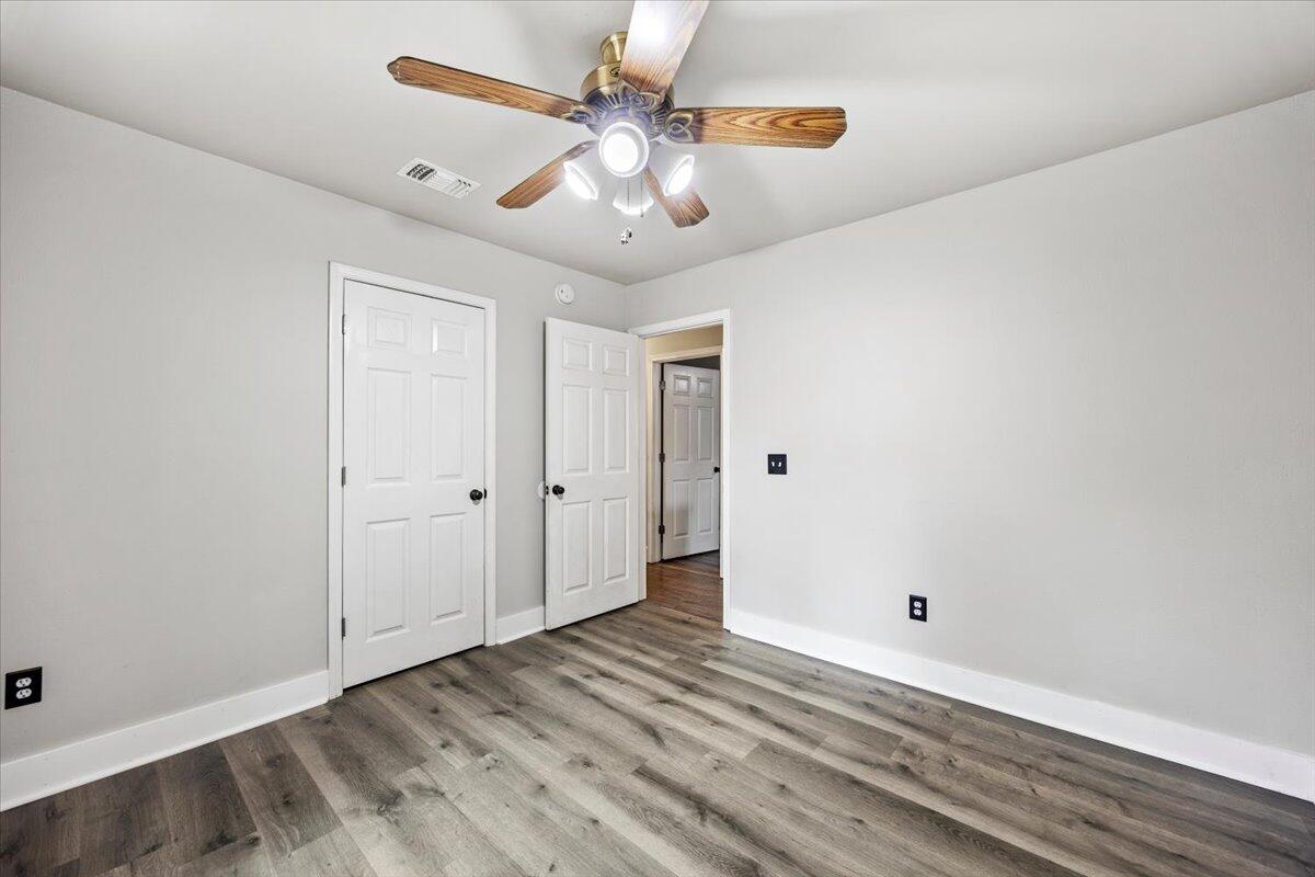 6060 Allegro Street Milton, FL 32583 - Photo 16 of 32 wooden floor in an empty room