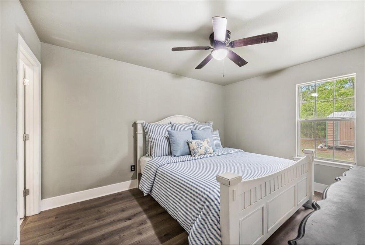 6060 Allegro Street Milton, FL 32583 - Photo 17 of 32 a bedroom with a bed and window
