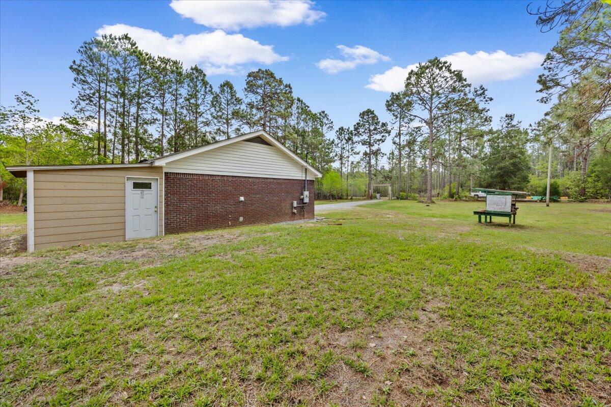 6060 Allegro Street Milton, FL 32583 - Photo 20 of 32 a view of a backyard