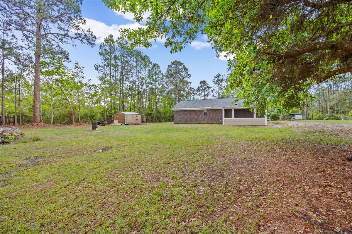 6060 Allegro Street Milton, FL 32583 - Photo 24 of 32 a house view with a garden space