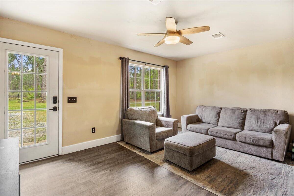 6060 Allegro Street Milton, FL 32583 - Photo 3 of 32 a living room with furniture and a window