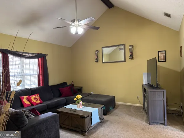 a living room with furniture and a window