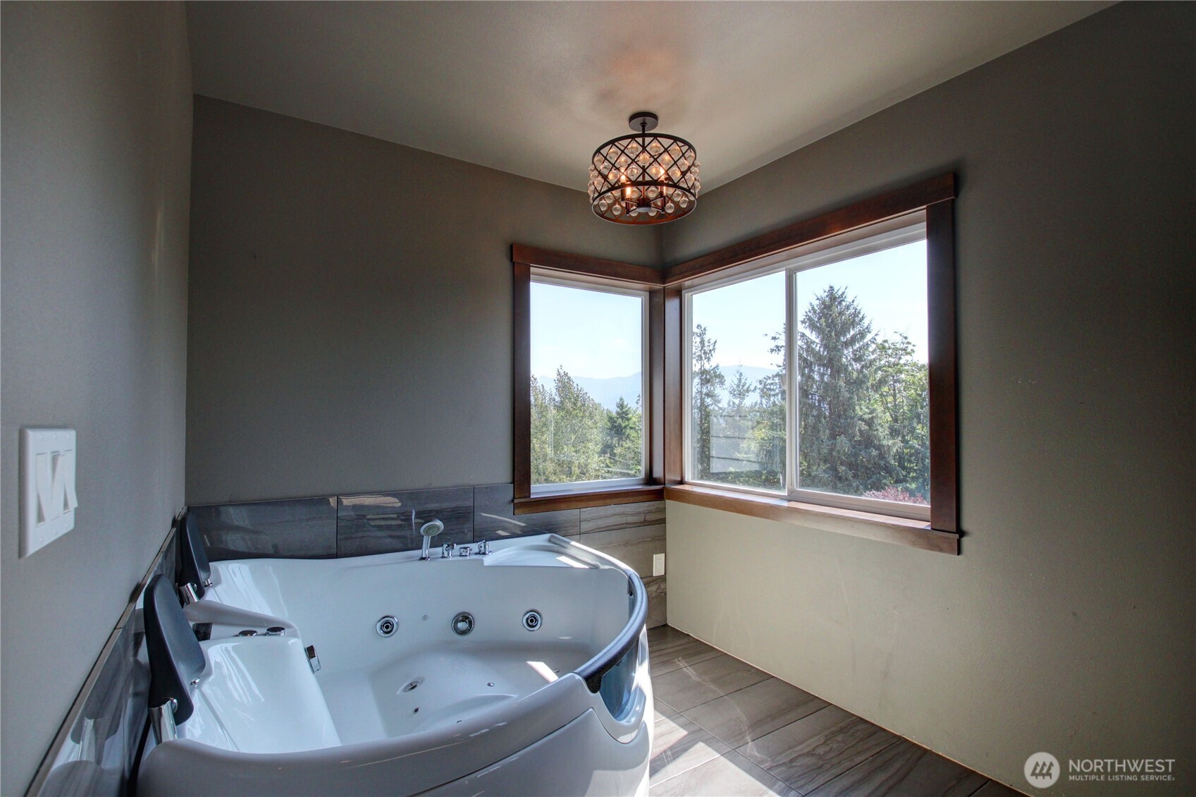 426 Longtime Lane Sedro-Woolley, WA 98284 - Photo 19 of 28 a bath tub sitting in a bathroom next to a window