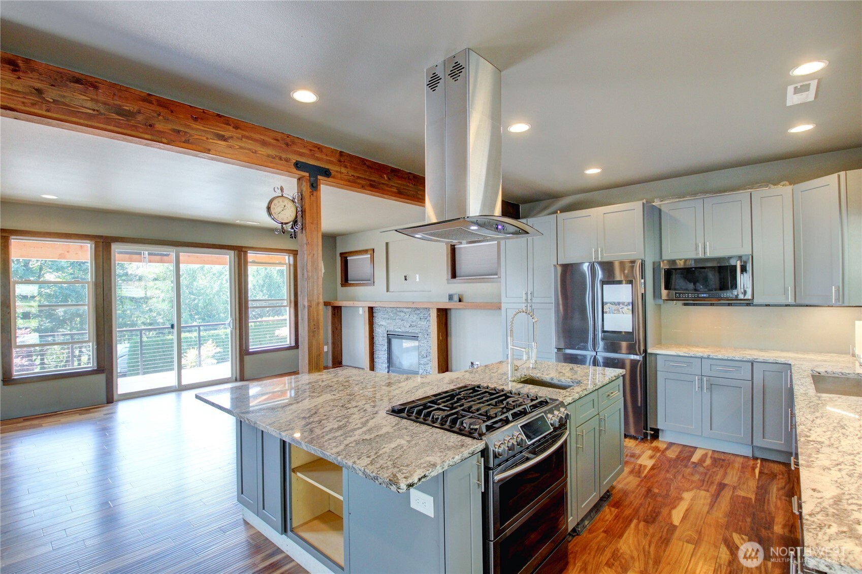 426 Longtime Lane Sedro-Woolley, WA 98284 - Photo 7 of 28 a kitchen with stainless steel appliances granite countertop a stove and a wooden floors