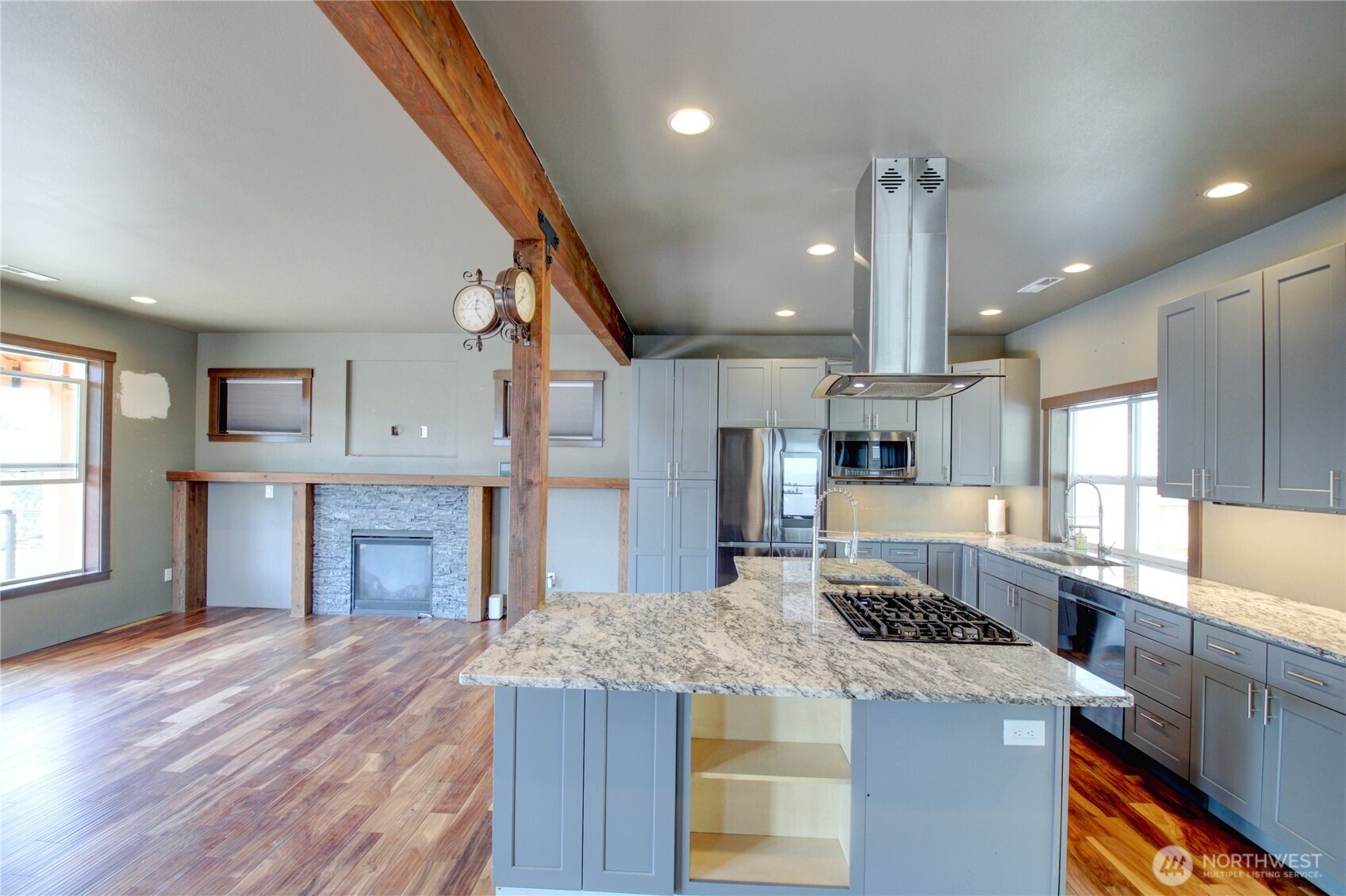 426 Longtime Lane Sedro-Woolley, WA 98284 - Photo 8 of 28 a kitchen with stainless steel appliances granite countertop a sink a stove and a wooden floors