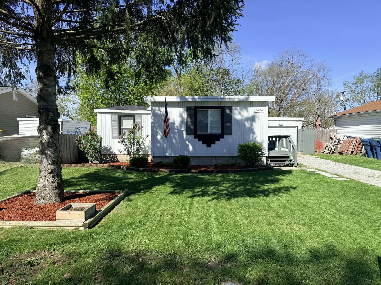 3634 Sangamon Street Steger, IL 60475 - Photo 3 of 17 a view of a backyard with table and chairs potted plants and large tree