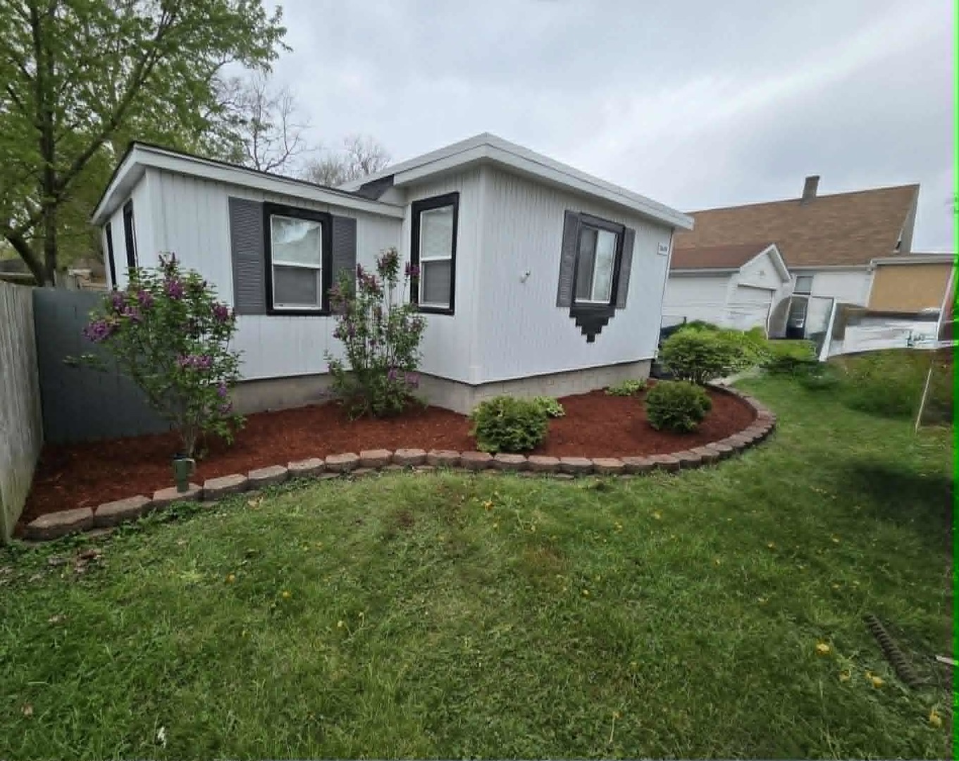 3634 Sangamon Street Steger, IL 60475 - Photo 4 of 17 a view of a house with a yard and potted plants