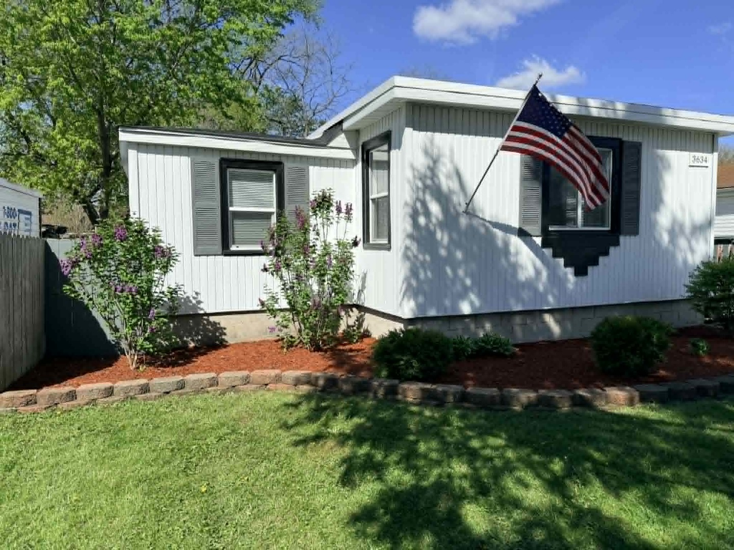 3634 Sangamon Street Steger, IL 60475 - Photo 6 of 17 a front view of a house with a yard