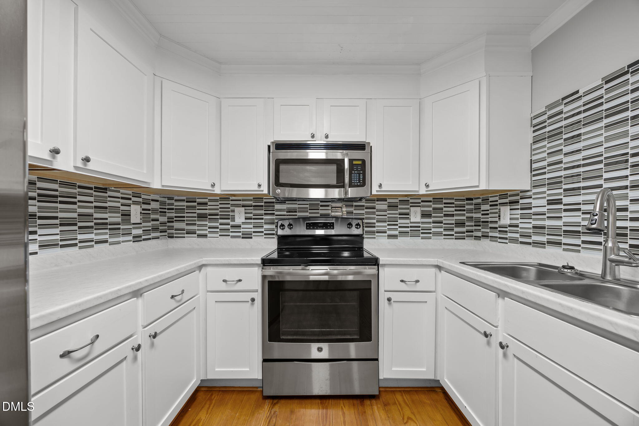5869 Deans Street Bailey, NC 27807 - Photo 24 of 62 a kitchen with cabinets stainless steel appliances and a sink